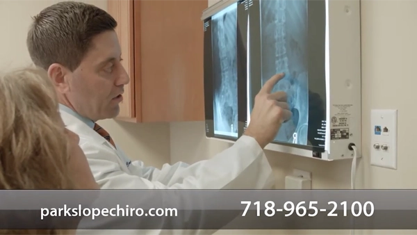 Chiropractor Brooklyn NY Kenneth Campo Pointing To XRay